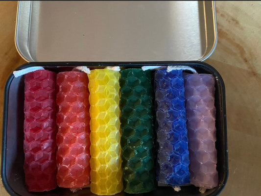 6 spell chime candles in a tin red orange yellow green blue purple
